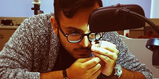 Nikhil Hathiramani Facets Second Generation inspecting a diamond